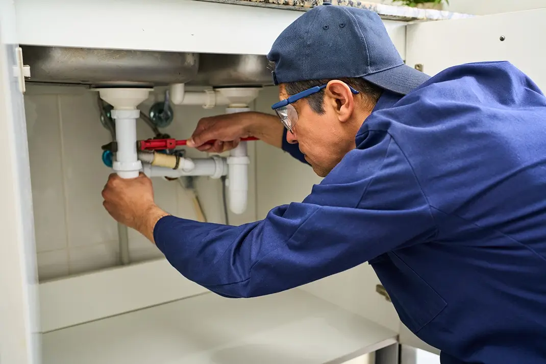 Licensed plumber fixing sink for home improvement, drainage and water system